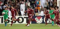 图文-亚运男足伊拉克0-1卡塔尔队员欢庆进球