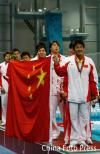 图文-亚运会男子水球中国队夺冠聆听国歌响起
